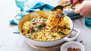 Creamy Pumpkin Sauce & Zucchini Noodles in a bowl being served up